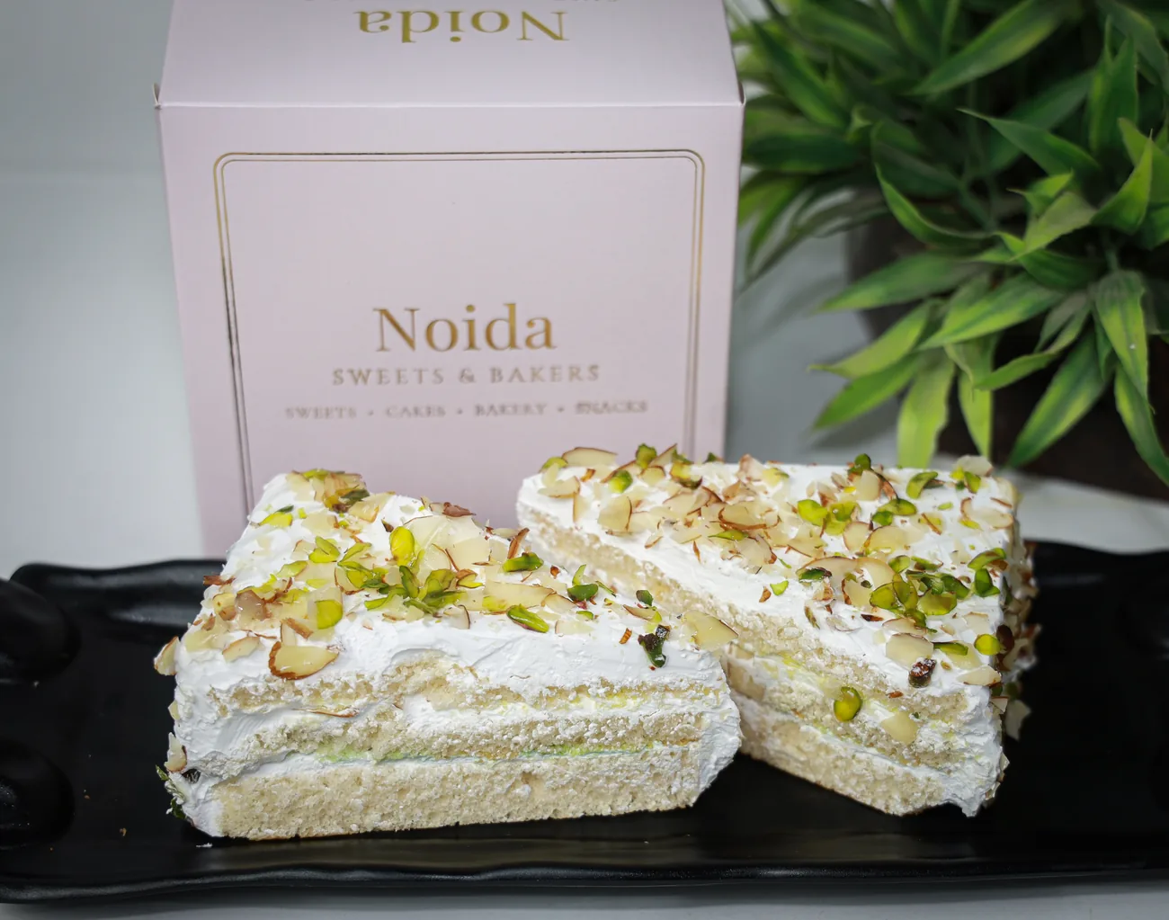 Badam pista pastry with our gift box — fresh from the Noida Sweets and Bakers oven