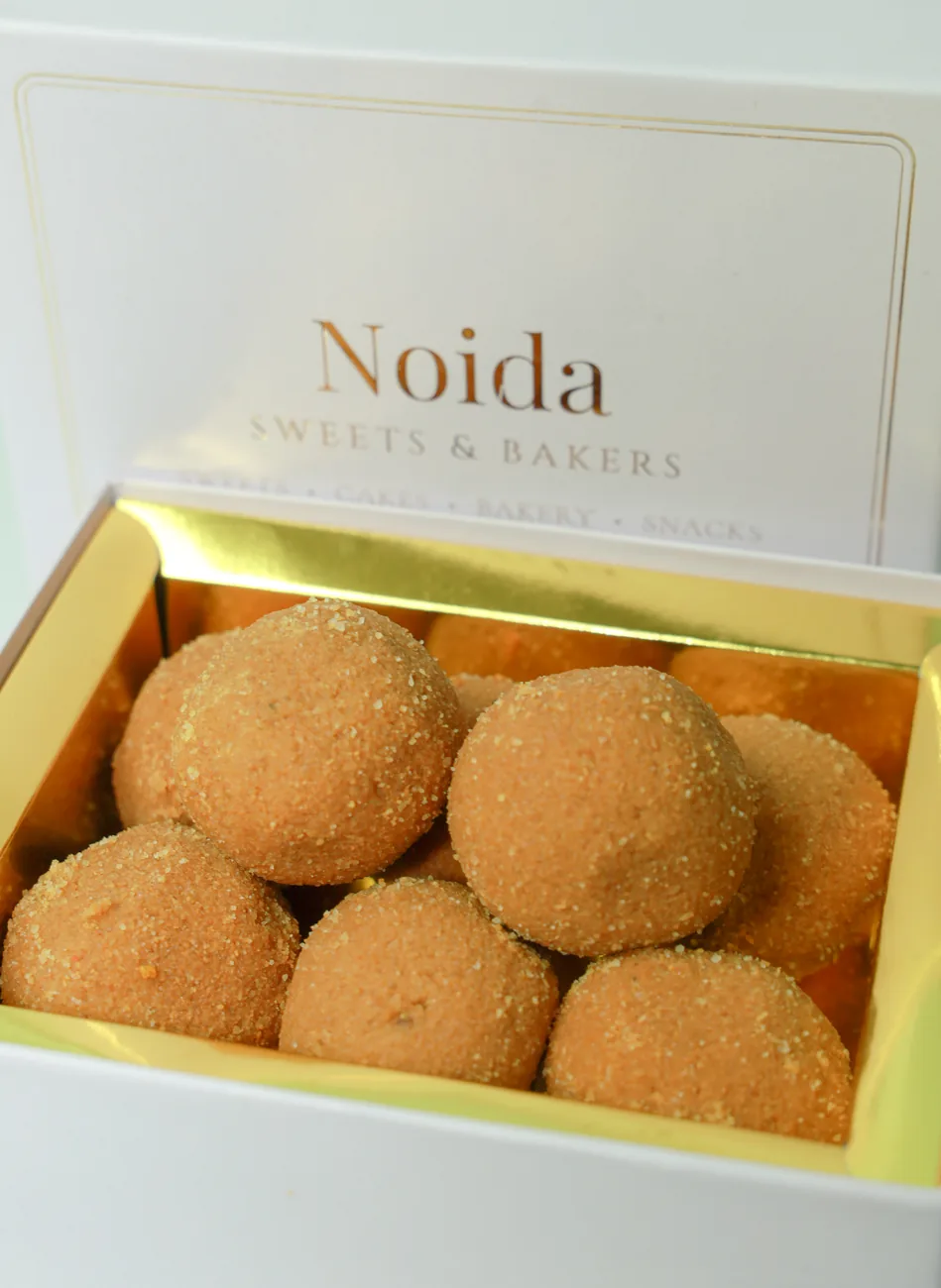 Besan laddus in a branded gift box — our photo