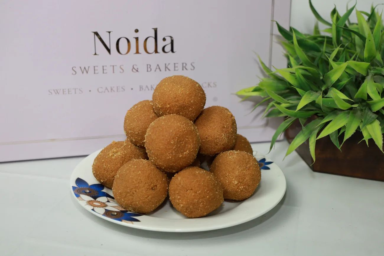 Besan laddus with the branded box — our photo