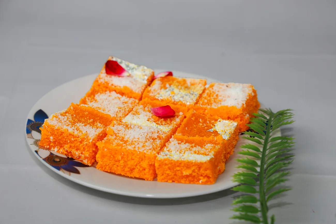 Orange coconut barfi squares — our photo
