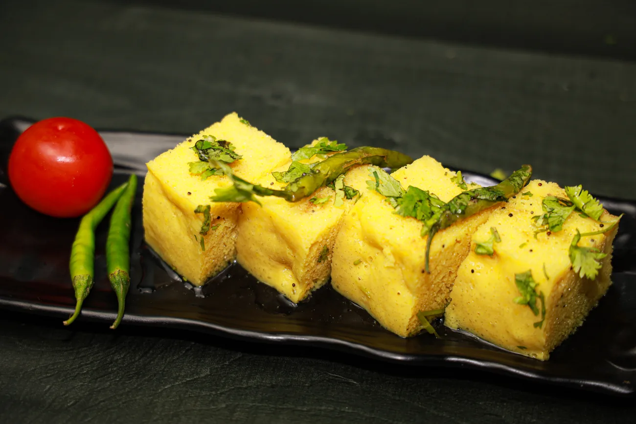 Khaman dhokla with tomato and chilli — our photo
