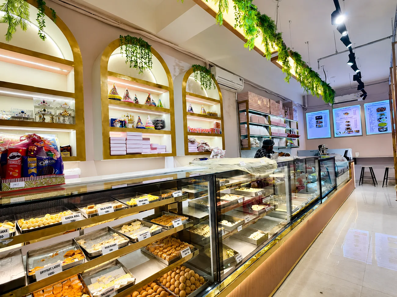 Inside Noida Sweets and Bakers — counters and gift shelves