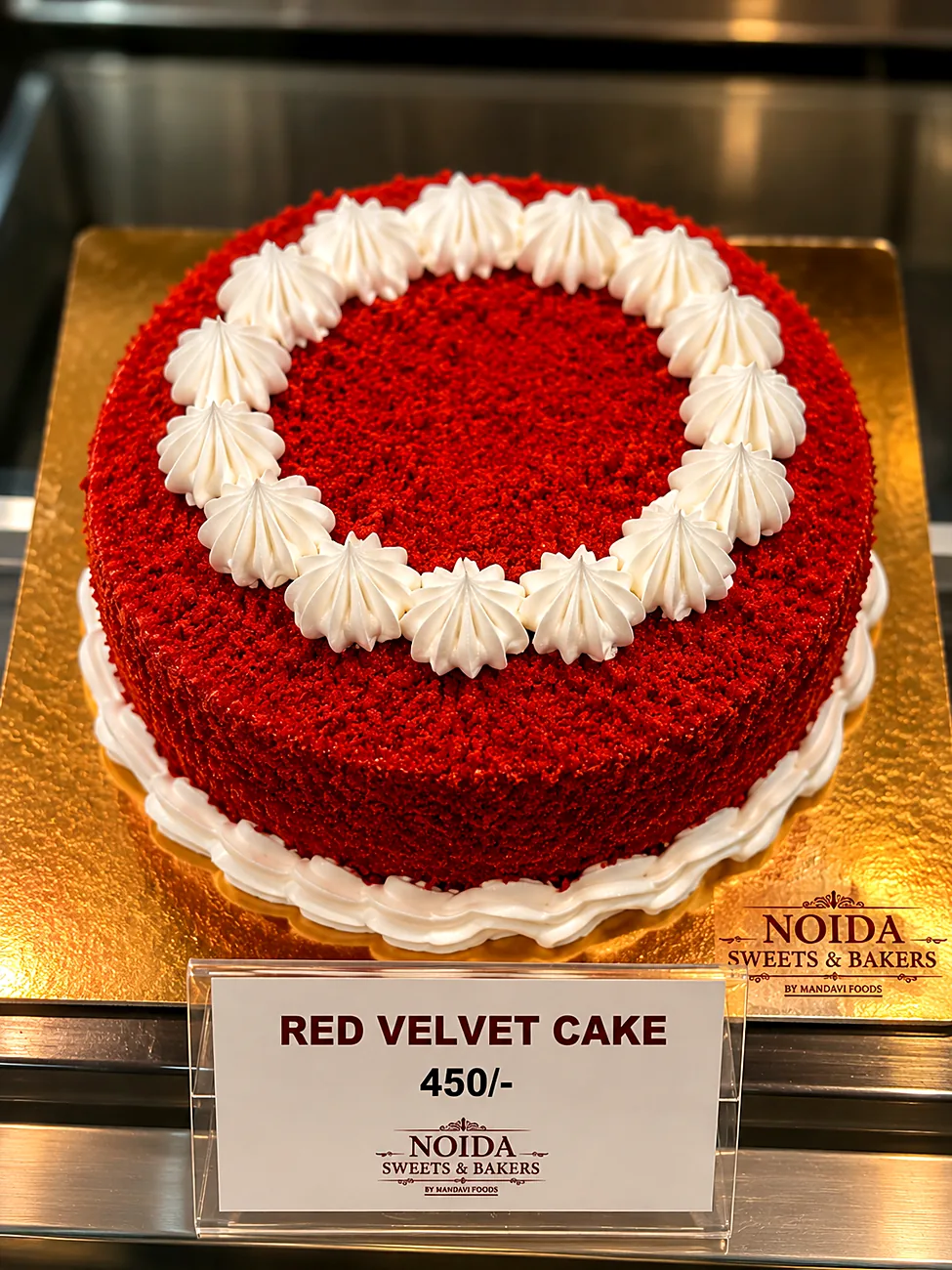 Red velvet cake with cream border — made at Noida Sweets and Bakers