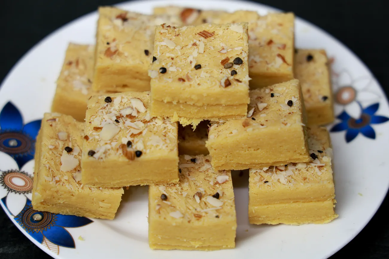 Flaky patisa squares with almond shavings — our photo
