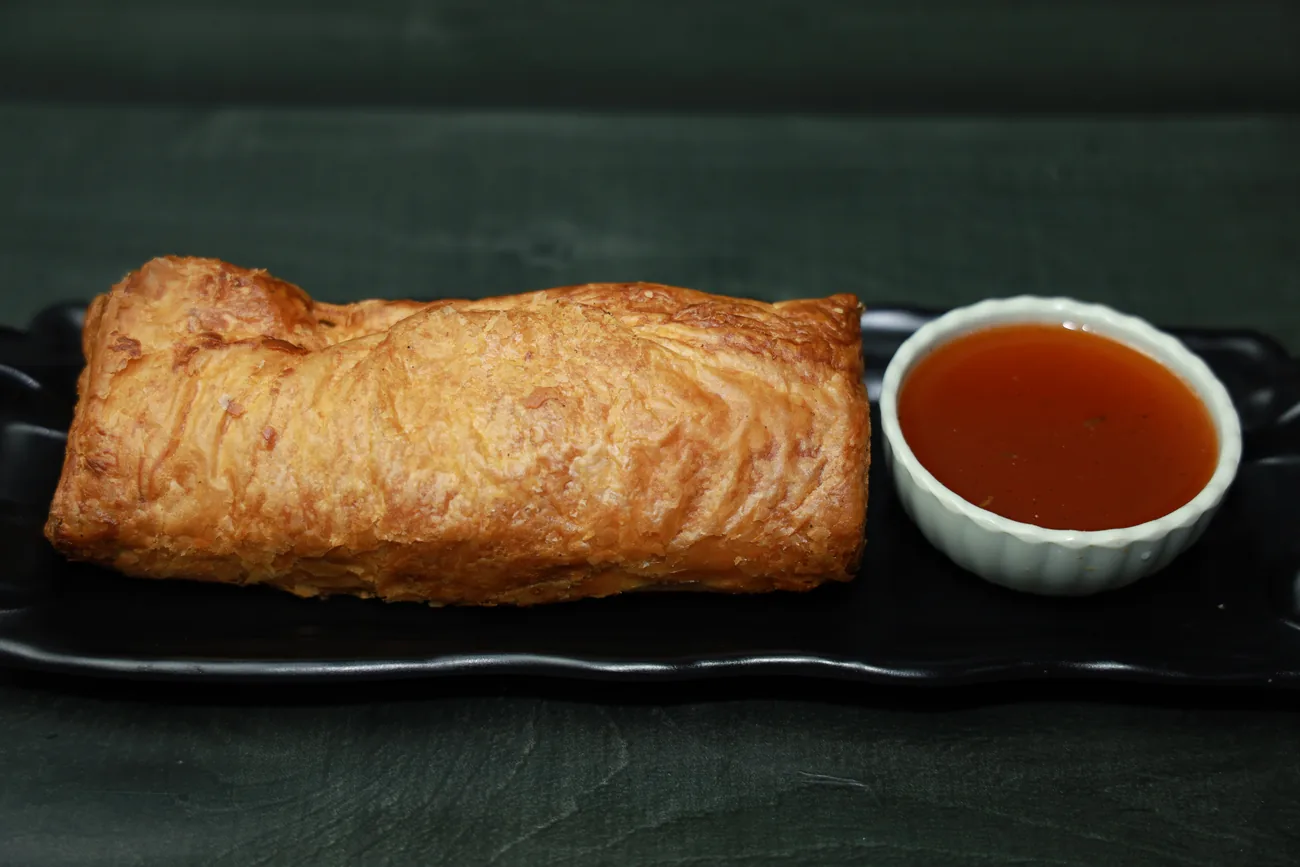 Fresh-baked flaky patty with dip — our photo